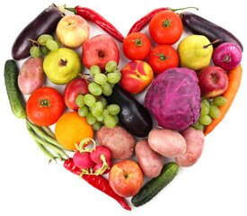 Fresh organic vegetables and fruits in shape of heart, isolated